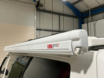 Fiamma F45s awning on a VW T6.1 with stealth B2 pop top