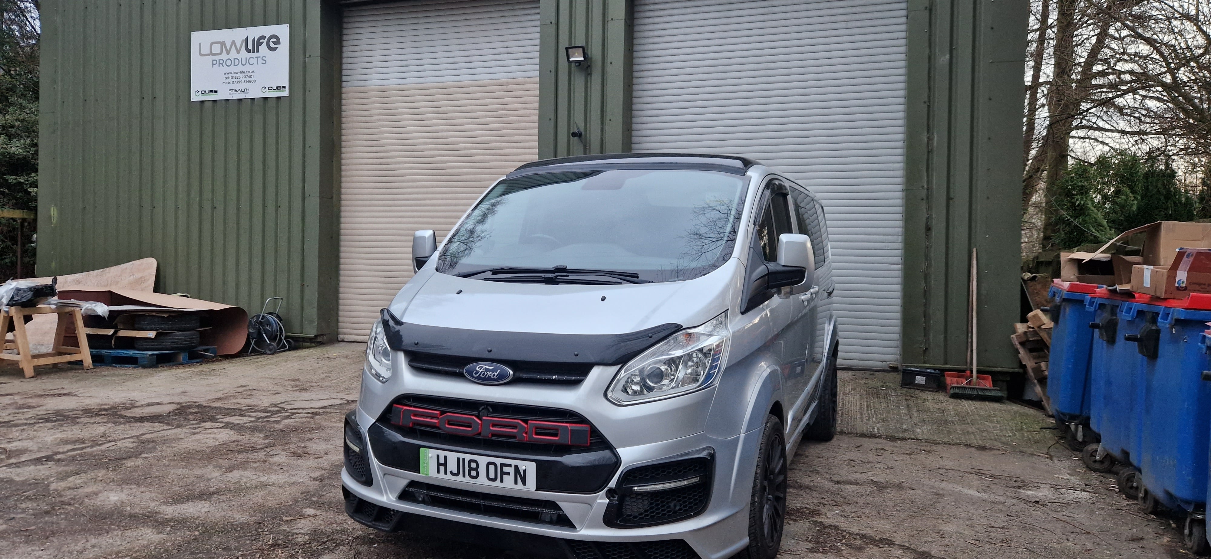 A ford transit custom parked in a garage ready for an unforgettable family staycation trip